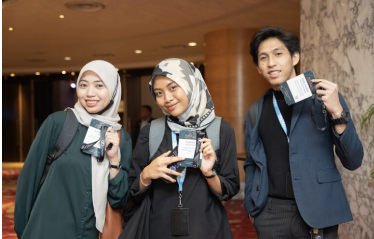 Attendees showing their conference badges