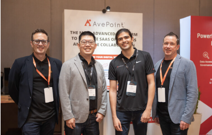 Attendees at the AvePoint sponsor booth