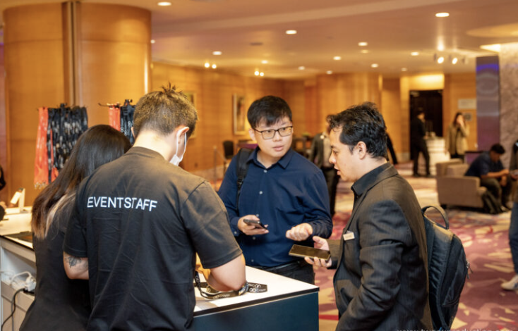 Guests checking in at registration